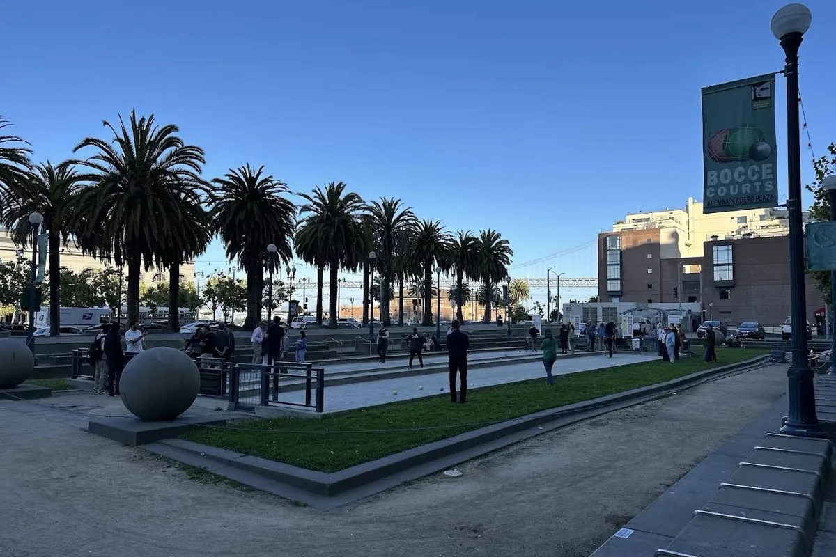 Blue and yellow bocce balls on the court